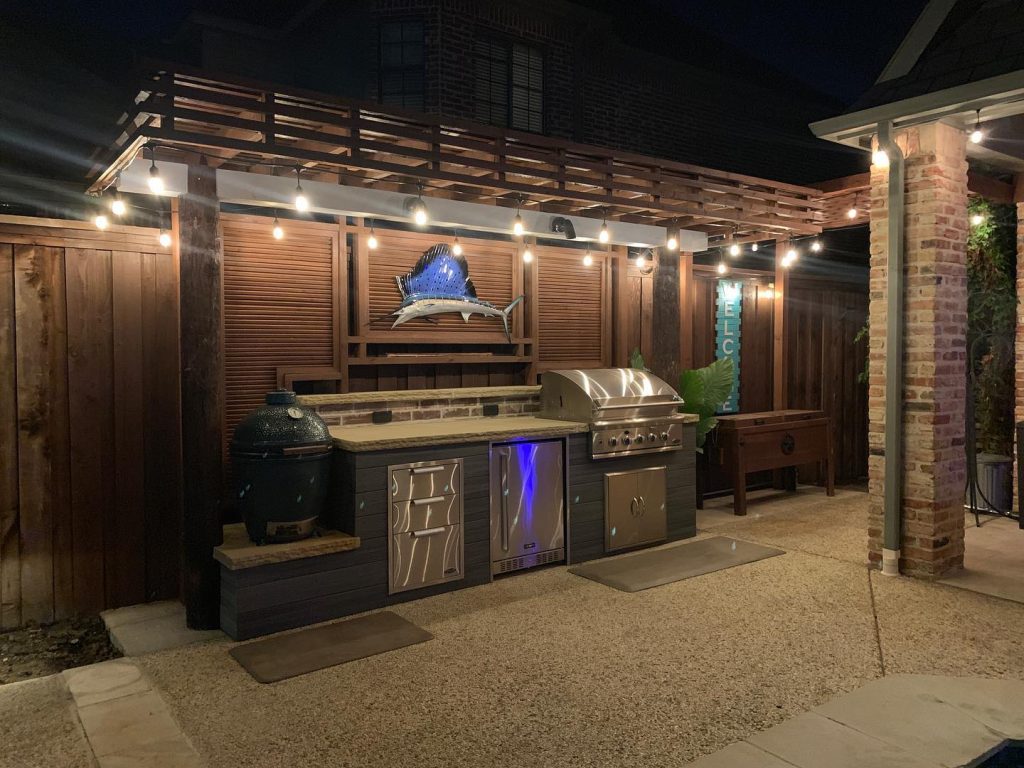 outdoor grill area with fish fixture above it
